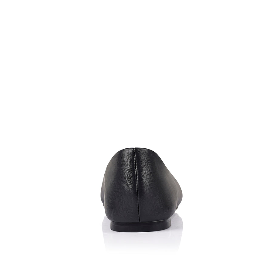 Black flat shoe with a square toe shape