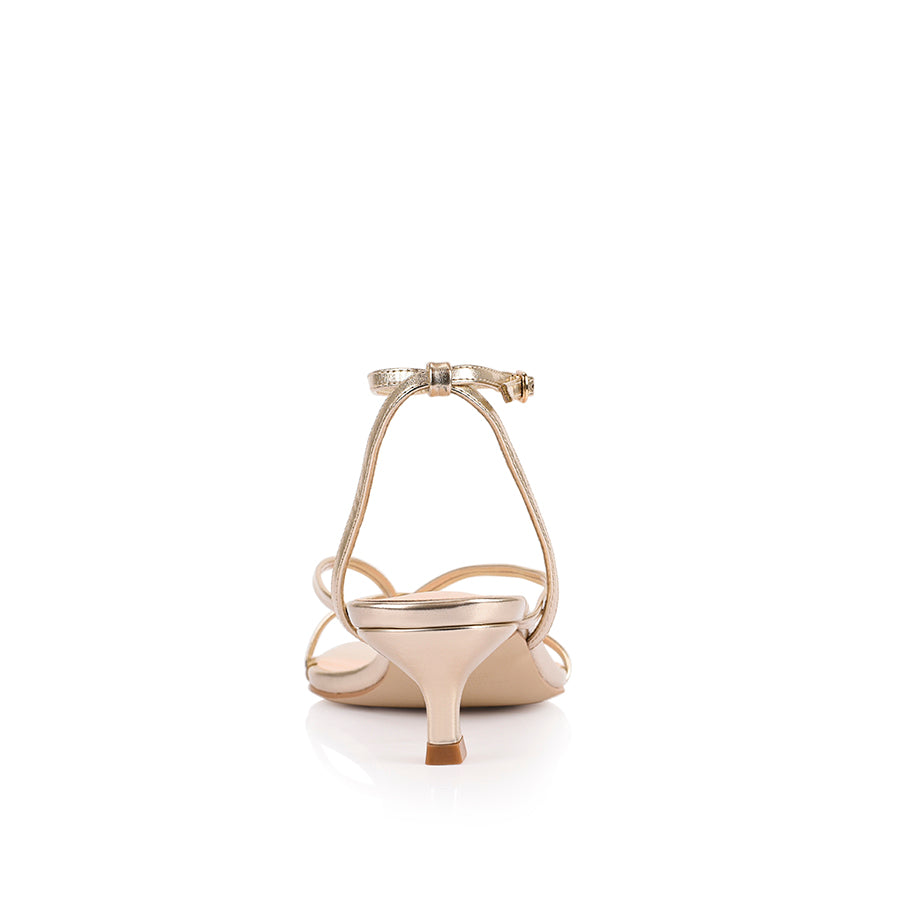 Women's low kitten heel, strappy thong style with adjustable ankle strap in metallic champagne gold