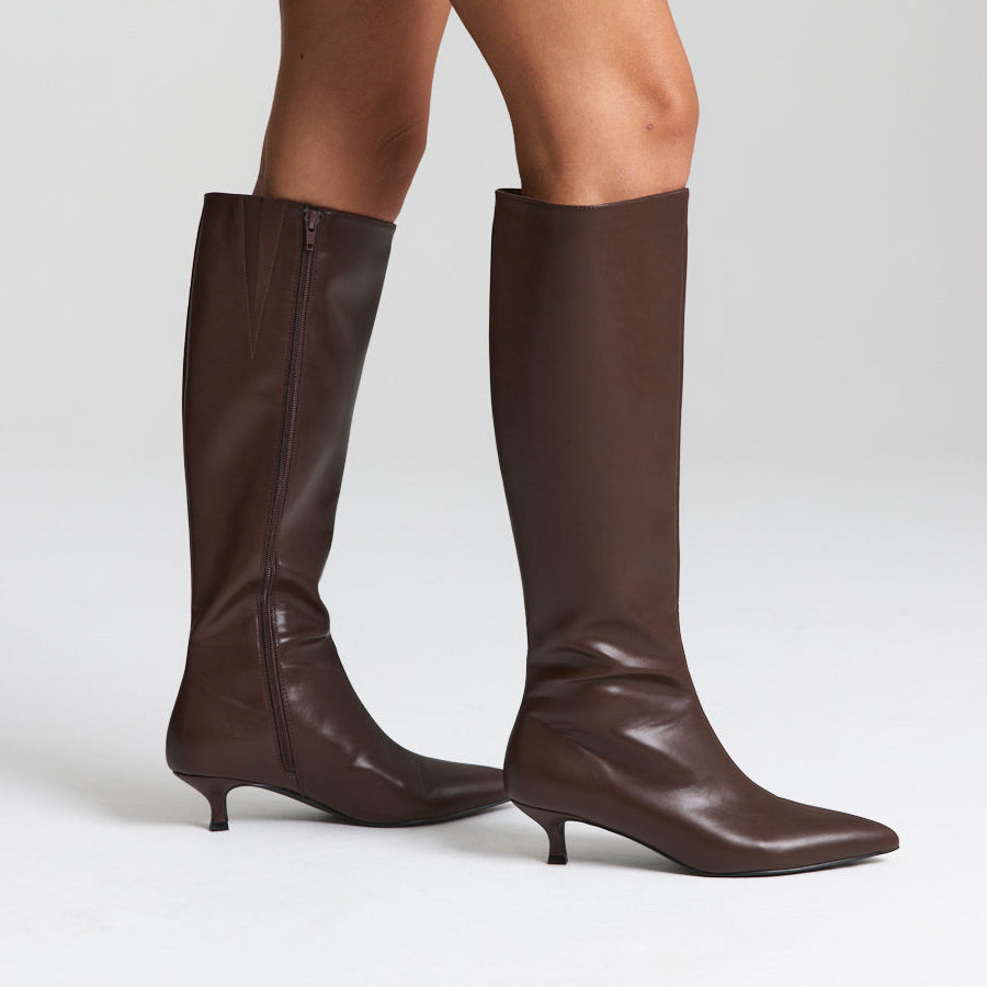 Brown high knee smooth boot with a kitten heel and zip closure