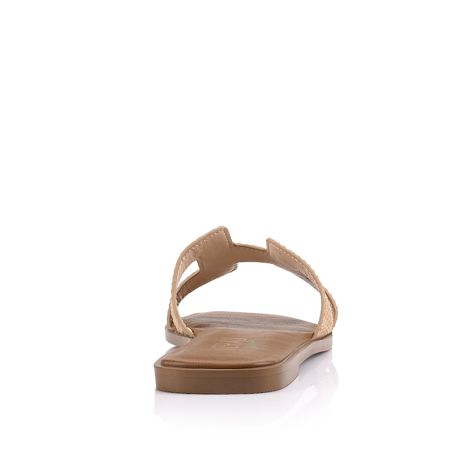 Women's flat slide sandal in tan vegan leather with natural raffia for summer