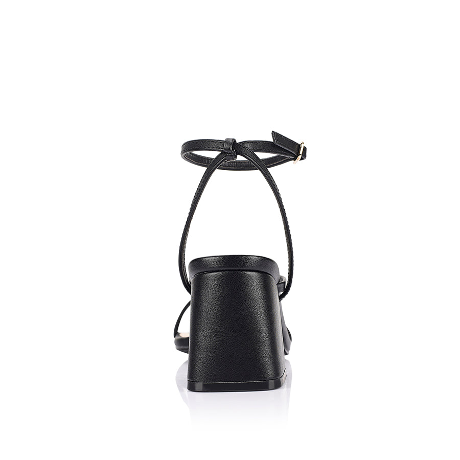 Black high-heeled sandal on a block heel with a square toe shape