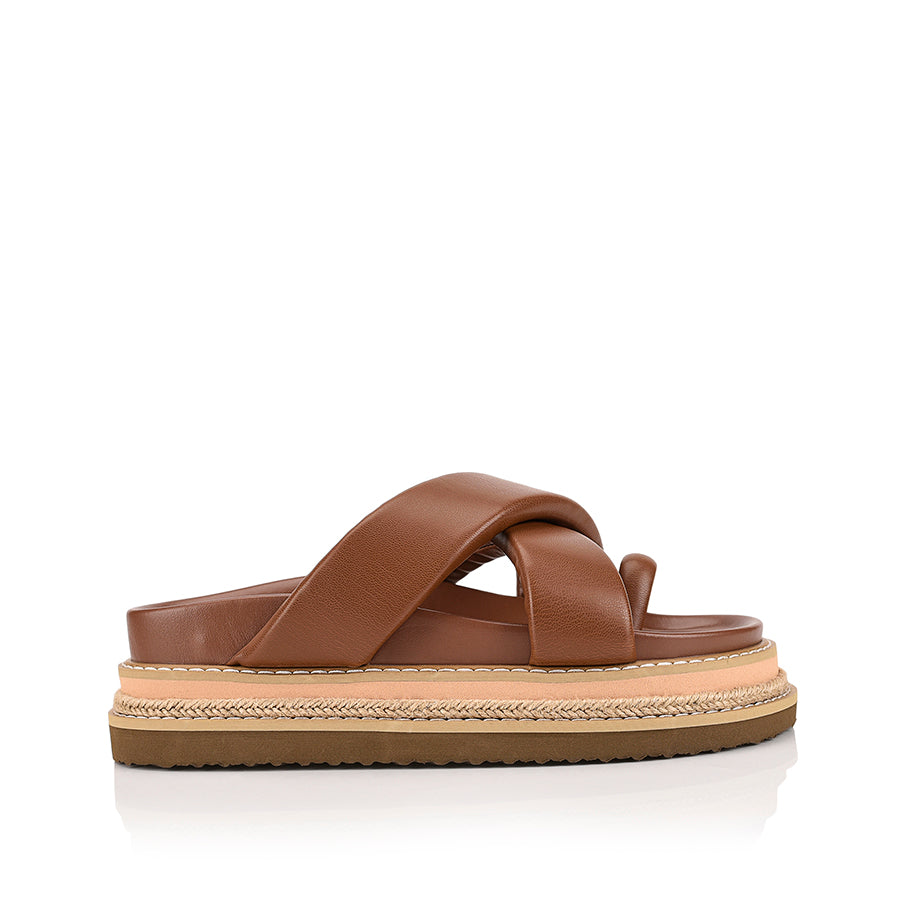 Women's brown puffy platform slides with toe ring and contrast sole