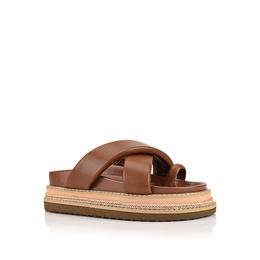 Women's brown puffy platform slides with toe ring and contrast sole