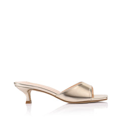 Gold sandal with kitten heel and square toe shape