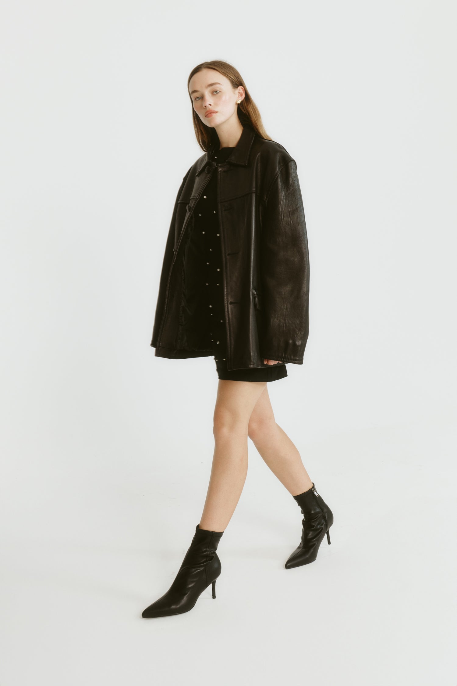 Womens black ankle sock boot with stiletto heel and pointed toe