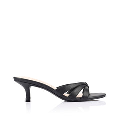 Black sandal mule with criss cross vamp on a kitten heel with a rounded toe shape