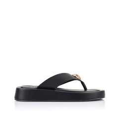 Women's black vegan platform thong with gold heart embellishment 