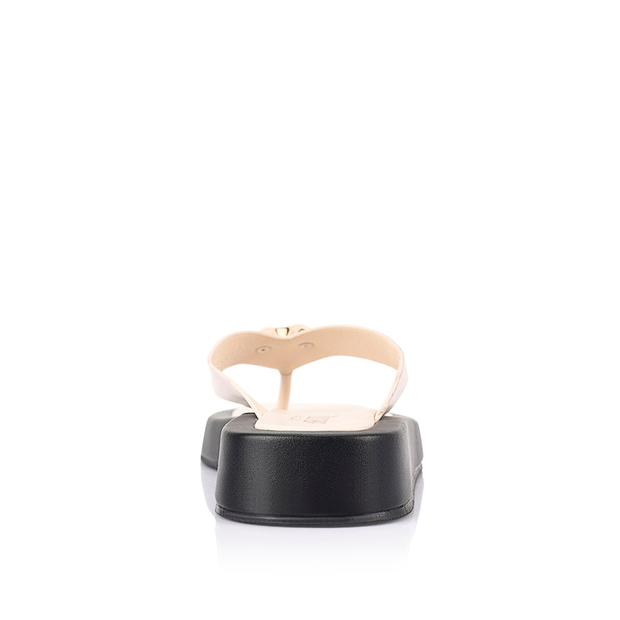 Women's black and bone white platform thong with gold heart embellishment 