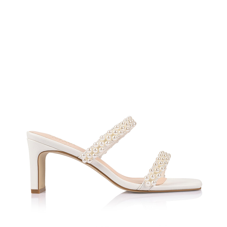 White sandal with pearl embellishments with a square toe shape
