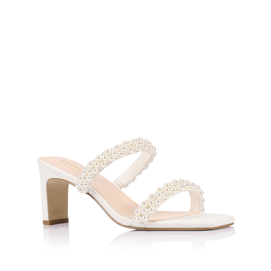 White sandal with pearl embellishments with a square toe shape