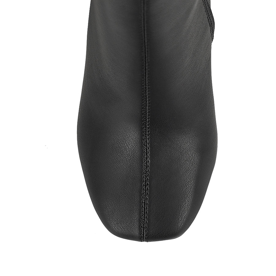 Black knee-high boot with a mid heel and square toe shape