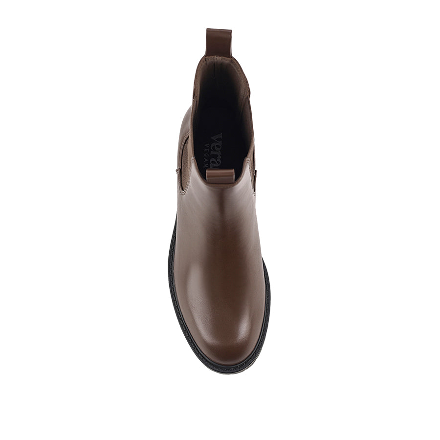 Brown Chelsea boot with a black sole with a rounded toe shape