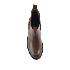 Brown Chelsea boot with a black sole with a rounded toe shape
