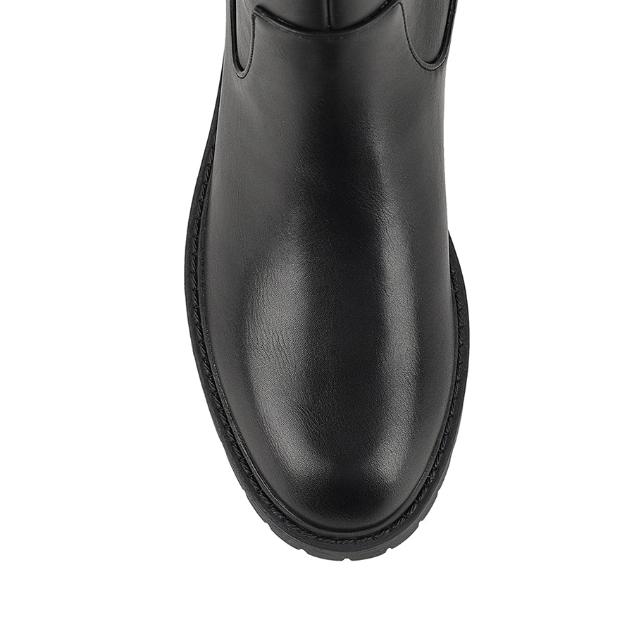 Black knee-high boot on a a chunky sole