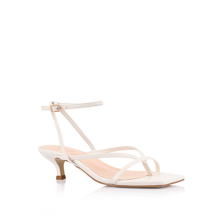 Women's low kitten heel, strappy thong style with adjustable ankle strap in smooth white