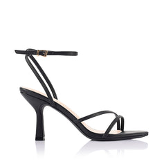 Black high-heeled sandal with thin straps that fasten with a gold buckle