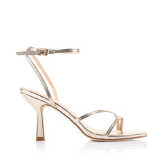 Gold high-heeled sandal with thin straps that fasten with a gold buckle
