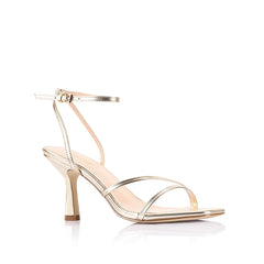 Gold high-heeled sandal with thin straps that fasten with a gold buckle
