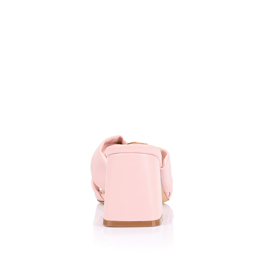 Women's blush pink block heel mules with crossover vamp straps and gold ring detailing