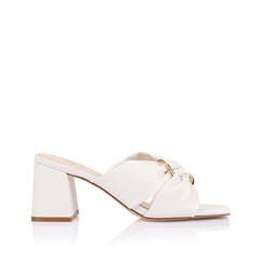 Women's white block heel mules with crossover vamp straps and gold ring detailing