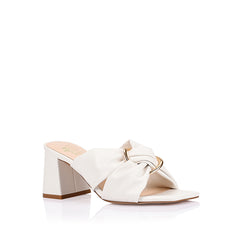 Women's white block heel mules with crossover vamp straps and gold ring detailing