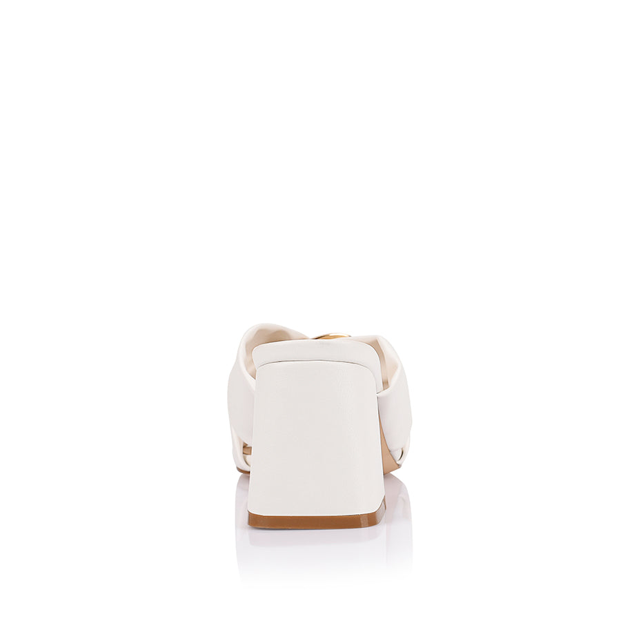Women's white block heel mules with crossover vamp straps and gold ring detailing