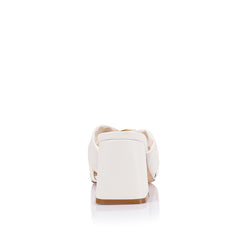 Women's white block heel mules with crossover vamp straps and gold ring detailing