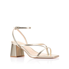 Gold high-heeled sandal on a block heel with a square toe shape