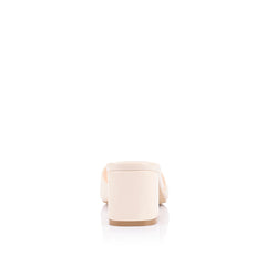 White block heel mule with a square toe shape